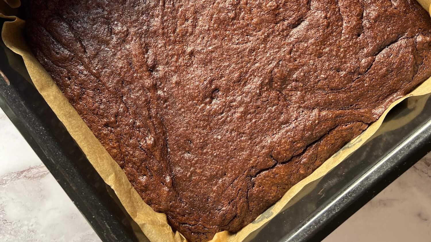 Baked brownie in tin