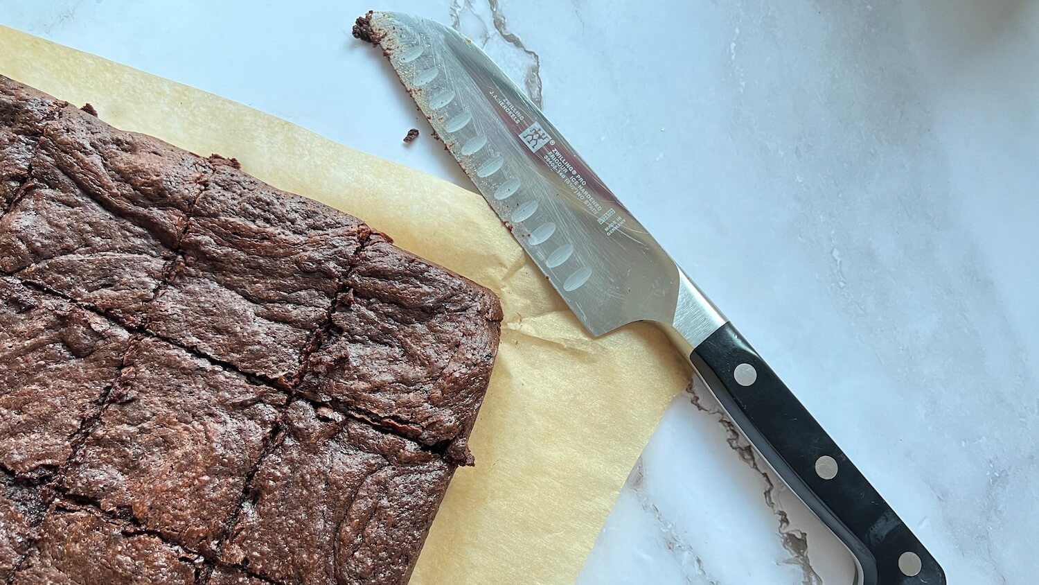 Cut brownie pieces with knife